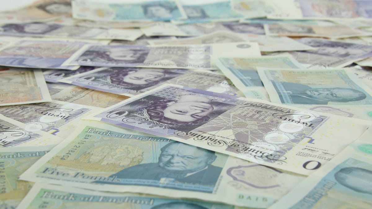 A pile of British banknotes: the cash difference between gross pay and what actually reaches your account